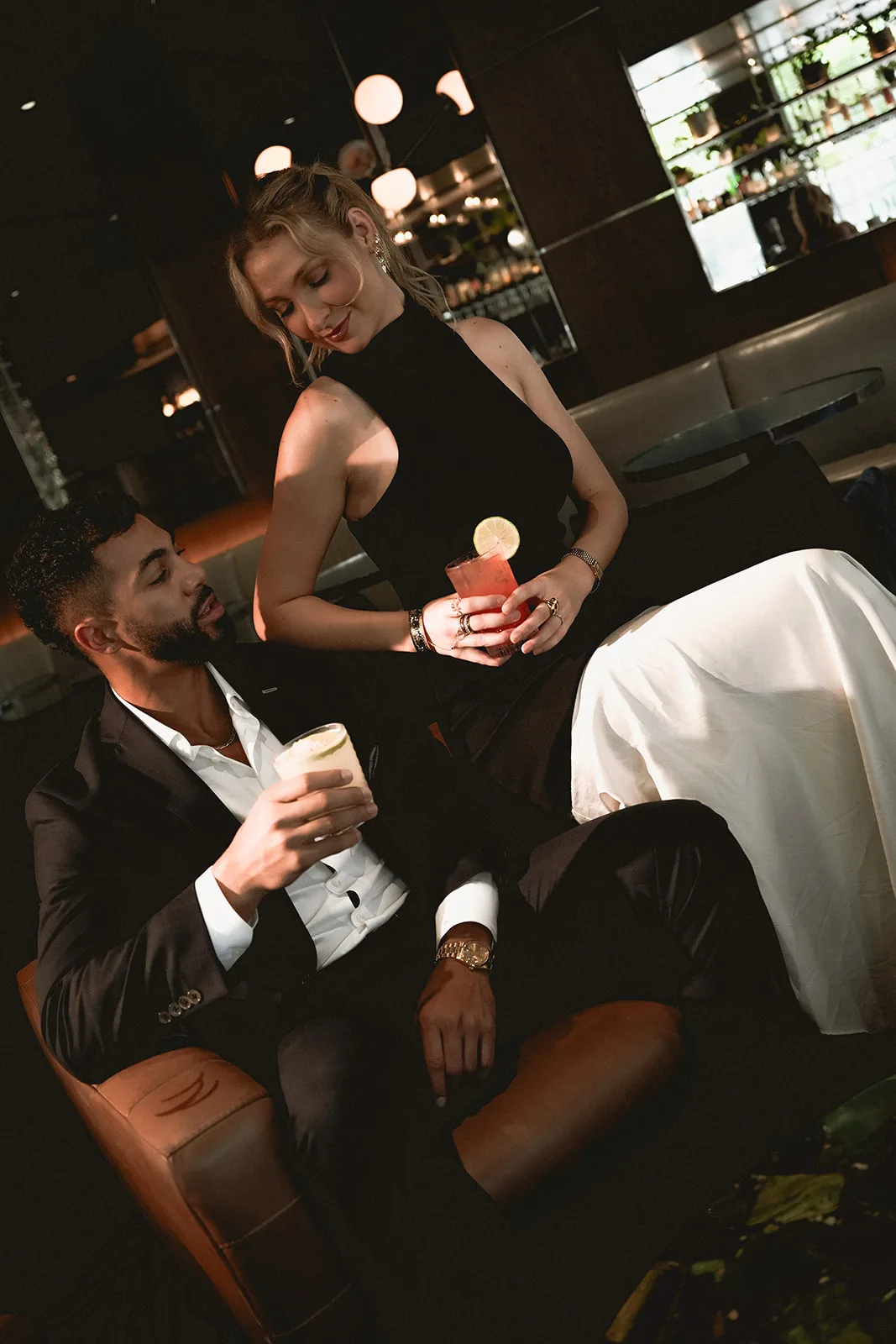 A couple at a candlelit dinner table
